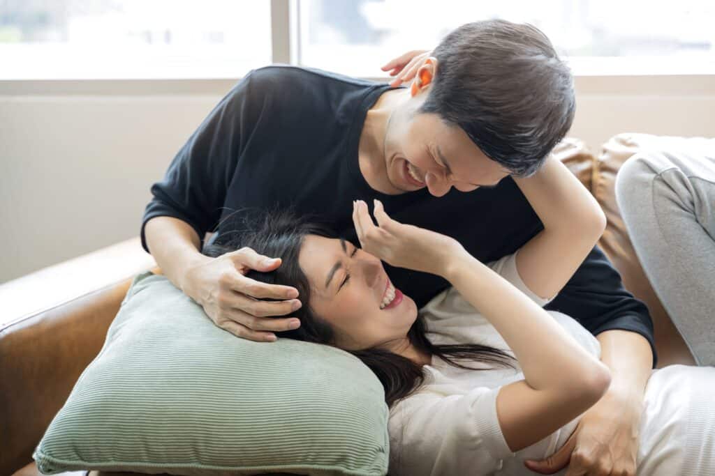 asian-marry-couple-love-sharing-genuine-emotions-happiness-hugging-sofa-couch-morning-light-living-room-home-interior-background-home-isolation-concept 情侶相處