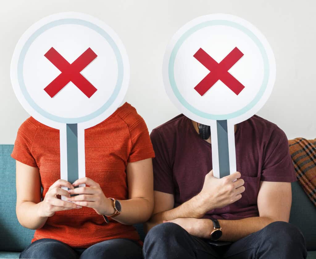 Couple showing no symbol sign 注意事項